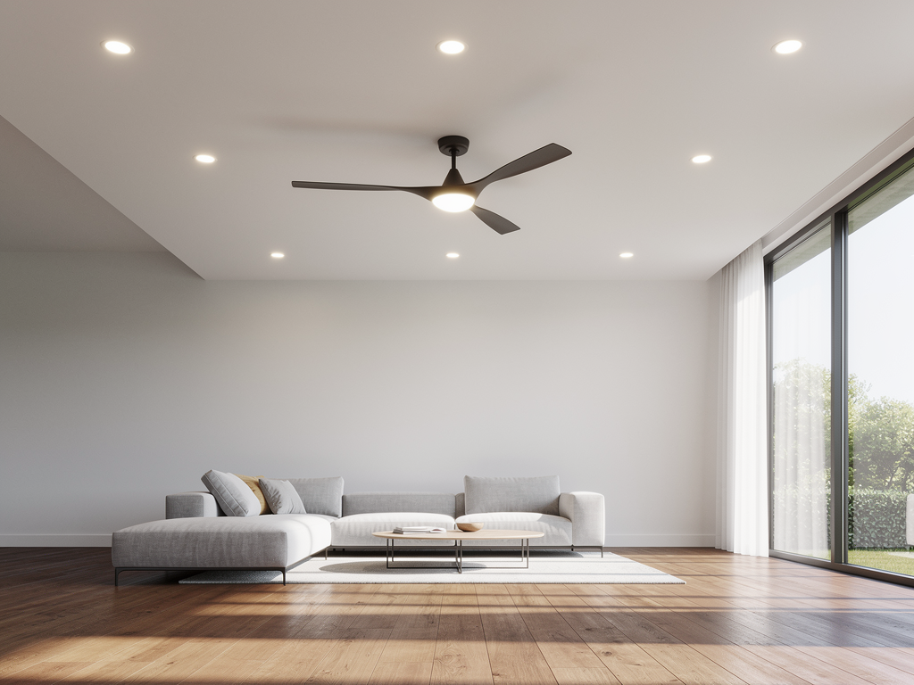 A bright modern living room with newly installed recessed lighting and a ceiling fan